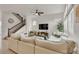 Spacious living room with comfortable seating, modern entertainment unit, and a cozy atmosphere at 6619 Mariposa Ct, Denver, CO 80221