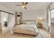 Serene main bedroom featuring a ceiling fan and natural light at 6619 Mariposa Ct, Denver, CO 80221