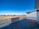 Balcony view showcases the neighborhood and nearby open land, perfect for enjoying the outdoors at 46549 Avery Ln, Bennett, CO 80102
