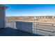 Balcony view showcases a scenic view of distant mountains and the surrounding neighborhood at 46549 Avery Ln, Bennett, CO 80102