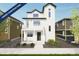 New construction two-story modern farmhouse with white siding, black trim, balcony, and manicured front yard at 46549 Avery Ln, Bennett, CO 80102