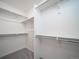 Large walk-in closet with ample shelving and clothing rods providing organized storage space at 46549 Avery Ln, Bennett, CO 80102