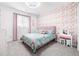 Charming bedroom with floral wallpaper and a pink vanity set at 4739 Gray Wolf Ln, Castle Rock, CO 80104