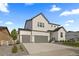 Charming modern farmhouse with a three-car garage and manicured landscaping at 4739 Gray Wolf Ln, Castle Rock, CO 80104