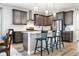 Modern kitchen features a central island with barstool seating and stainless steel appliances at 4739 Gray Wolf Ln, Castle Rock, CO 80104