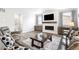 Cozy living room featuring a fireplace, comfortable seating, and plenty of natural light at 4739 Gray Wolf Ln, Castle Rock, CO 80104