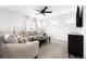 Upstairs living space with a ceiling fan, plush seating, and neutral decor at 4739 Gray Wolf Ln, Castle Rock, CO 80104