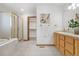 Well-lit primary bathroom featuring a soaking tub, glass shower, and double vanity at 13516 Thorncreek Cir, Thornton, CO 80241