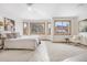 Bright main bedroom featuring large windows and neutral decor for a relaxing retreat at 13516 Thorncreek Cir, Thornton, CO 80241