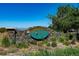 Community entrance sign to The Pointe at Thorncreek Golf Club surrounded by rocks and vegetation at 13516 Thorncreek Cir, Thornton, CO 80241