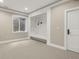 Bright bedroom with natural light, a unique elevated alcove, and neutral carpet at 8833 Portico Ln, Longmont, CO 80503