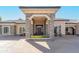 Inviting front entrance boasting a stone-clad portico and a solid wood door at 8833 Portico Ln, Longmont, CO 80503