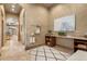 Functional mudroom with storage, a built-in desk, and easy access to the kitchen, perfect for organization at 8833 Portico Ln, Longmont, CO 80503