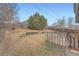 Backyard with wooden fences and grass at 22162 E Alamo Ln, Centennial, CO 80015