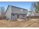 View of the backyard with a small patio area and full fence at 22162 E Alamo Ln, Centennial, CO 80015