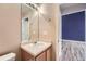 Bathroom features a sink, mirror and cabinet with neutral color at 22162 E Alamo Ln, Centennial, CO 80015