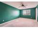 Large green bedroom with ceiling fan and a big window at 22162 E Alamo Ln, Centennial, CO 80015