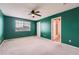 Spacious green bedroom with ceiling fan, window and ensuite bath at 22162 E Alamo Ln, Centennial, CO 80015