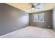 Bedroom with window, neutral carpet and light paint at 22162 E Alamo Ln, Centennial, CO 80015