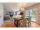 Bright dining area features wood floors and sliding door to the backyard at 22162 E Alamo Ln, Centennial, CO 80015