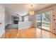 Bright dining area features wood floors and sliding door to the backyard at 22162 E Alamo Ln, Centennial, CO 80015