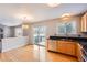 Bright kitchen with stainless steel appliances and a view of the backyard through large windows at 22162 E Alamo Ln, Centennial, CO 80015