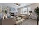 Comfortable living room with built-in bookshelves, fireplace, and lots of natural light at 22162 E Alamo Ln, Centennial, CO 80015