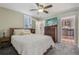 Cozy bedroom showcasing a comfortable bed and an adjacent doorway to the kitchen at 4165 Winona Ct, Denver, CO 80212