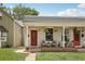 Charming duplex featuring inviting front porches with colorful decor and blooming flower baskets at 4165 Winona Ct, Denver, CO 80212