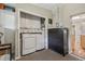 Convenient laundry area featuring washer and dryer, built-in storage, and a dresser at 4165 Winona Ct, Denver, CO 80212