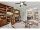 Inviting living room with a built-in bookcase, fireplace, and an open layout at 4165 Winona Ct, Denver, CO 80212