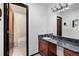 Bathroom featuring a granite countertop, modern fixtures, and a shower at 5197 S Perry St, Littleton, CO 80123