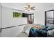 This bedroom is well-lit, and has exterior access and TV at 5197 S Perry St, Littleton, CO 80123