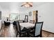 Dining area with wood floors and open concept floorplan at 5197 S Perry St, Littleton, CO 80123