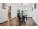 This dining area has wood-look tile flooring and a modern ceiling fan at 5197 S Perry St, Littleton, CO 80123