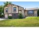 Charming two-story home with stone accents and a well-manicured front yard at 5197 S Perry St, Littleton, CO 80123