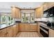 Bright kitchen featuring custom cabinets, granite countertops, and lots of natural light at 5197 S Perry St, Littleton, CO 80123