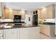Spacious kitchen with granite countertops, stainless appliances and custom cabinets at 5197 S Perry St, Littleton, CO 80123