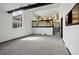Spacious living room with a large window, modern railing, and contemporary lighting at 5197 S Perry St, Littleton, CO 80123
