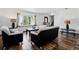 Bright living room featuring wood floors, a large window, and a modern, minimalist design at 5197 S Perry St, Littleton, CO 80123