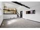 A spacious living room, complete with stairs and a view to the kitchen at 5197 S Perry St, Littleton, CO 80123