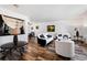 Open-concept living room with wood floors perfect for entertaining at 5197 S Perry St, Littleton, CO 80123