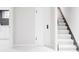 Finished basement with stairs, door, and adjacent living area with kitchenette at 620 Clermont St, Denver, CO 80220