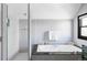 Modern bathroom featuring a soaking tub, separate shower, and elegant fixtures at 620 Clermont St, Denver, CO 80220