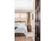 Comfortable bedroom with hardwood floors, neutral decor, and natural light at 620 Clermont St, Denver, CO 80220