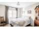 Cozy bedroom with a comfortable bed, decorative curtains, and charming wood floors at 620 Clermont St, Denver, CO 80220