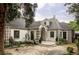Charming home with unique brick accents, a stone driveway and lush landscaping at 620 Clermont St, Denver, CO 80220