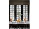 Modern kitchen sink with a window view and potted plants at 620 Clermont St, Denver, CO 80220
