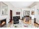 Bright living room featuring a fireplace, hardwood floors, and elegant décor at 620 Clermont St, Denver, CO 80220