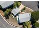 Aerial view of a home with a large backyard, detached garage, and mature trees at 6502 W 96Th Ave, Westminster, CO 80021